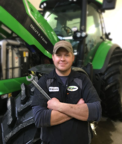 FarmPower Service Tech in front of Deutz Fahr Tractor